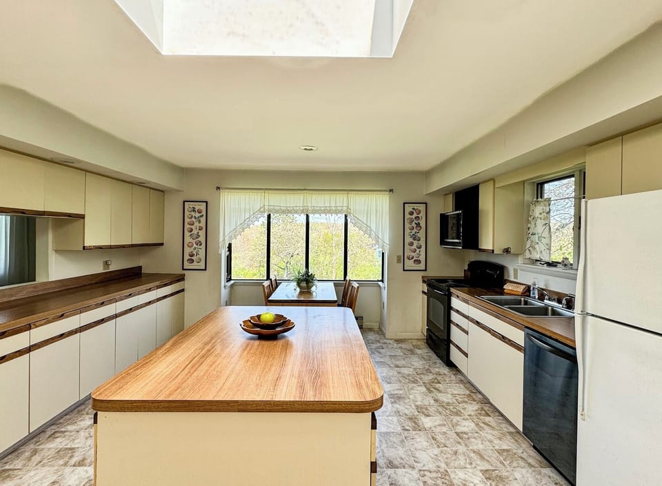 large eat in kitchen with oven, dishwasher, refrigerator and plenty of storage