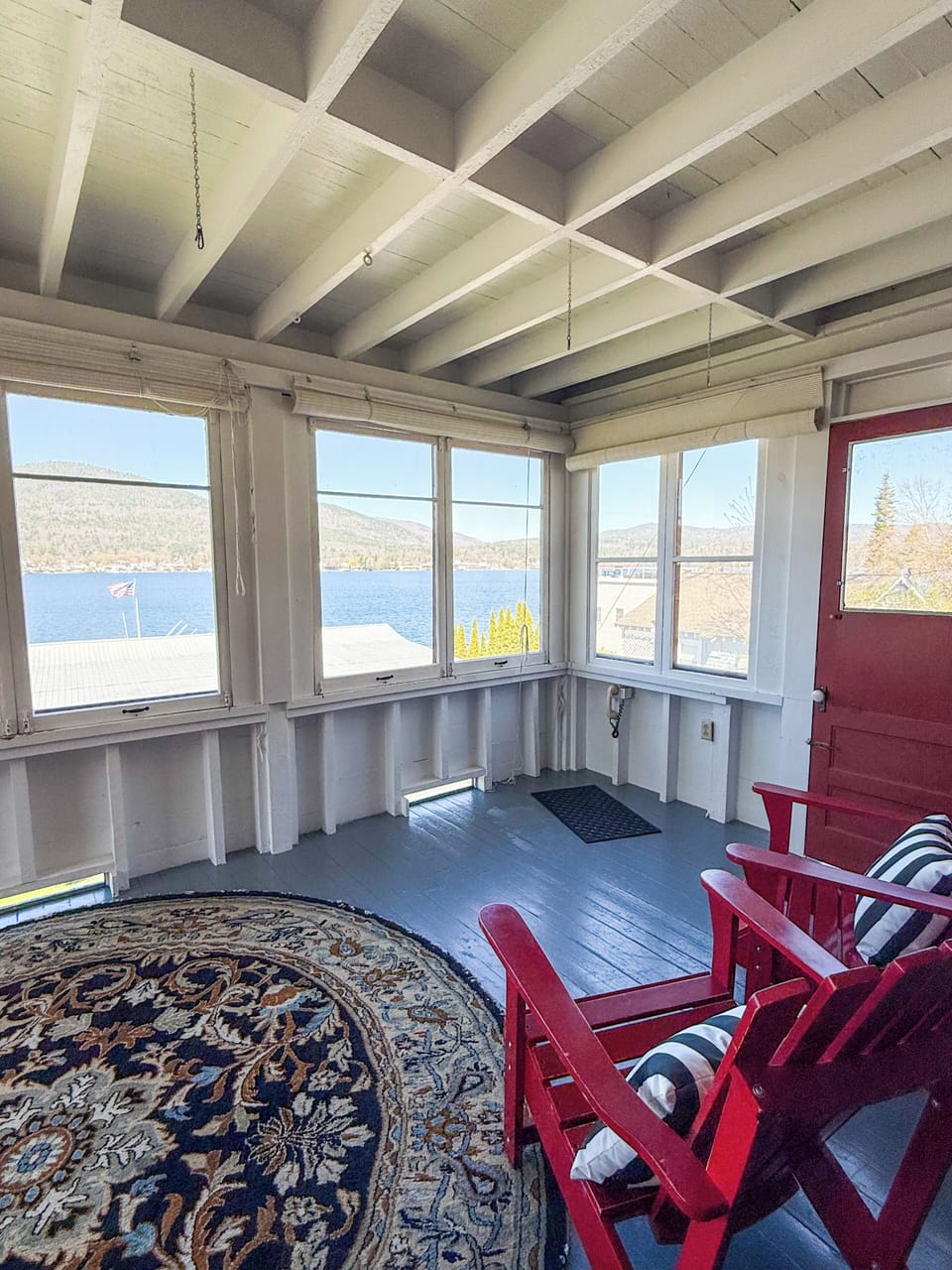 Enclosed porch off of the living room, offering beautiful views of Lake George
