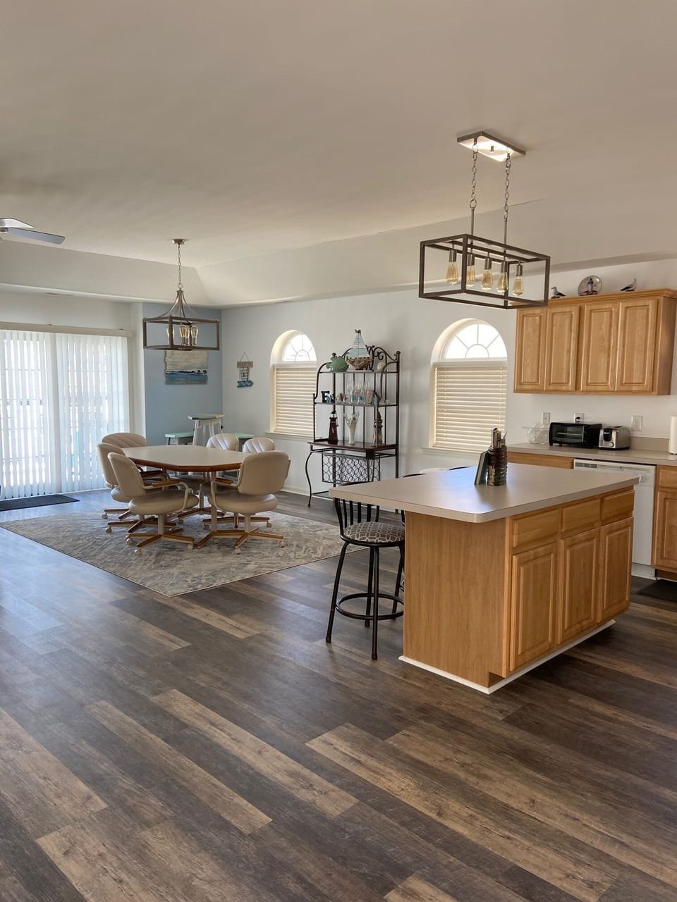 Dining table for six with 3 stools at the island