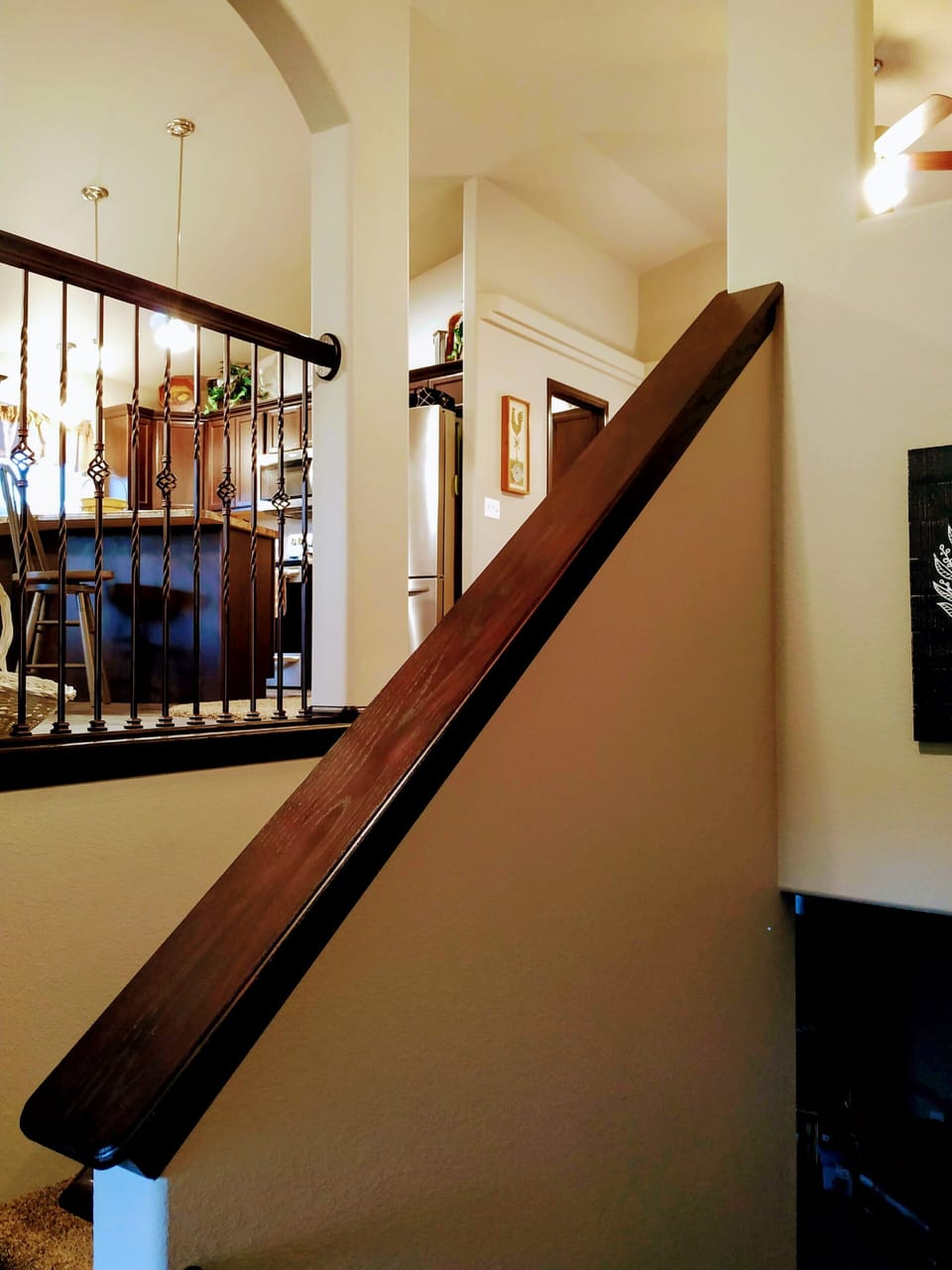 Steps to upper level with kitchen/dining, living area, and master bed/bath