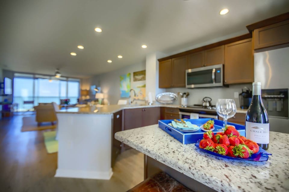 Beach views from the kitchen!  Large kitchen island to make cooking meals at home a breeze!