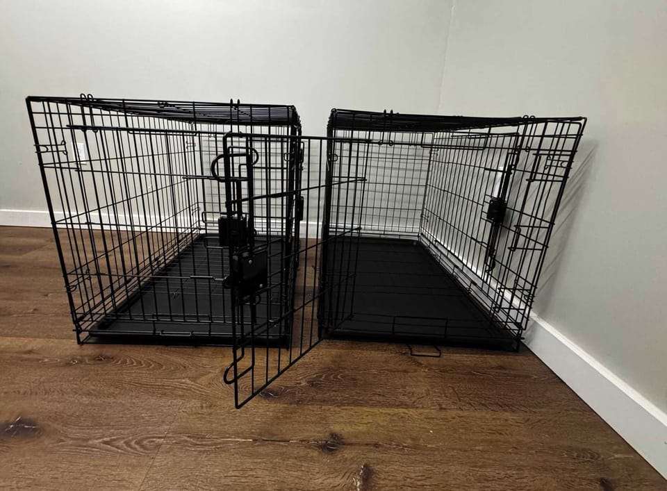 Large dog crates provided by owner located in top floor closet