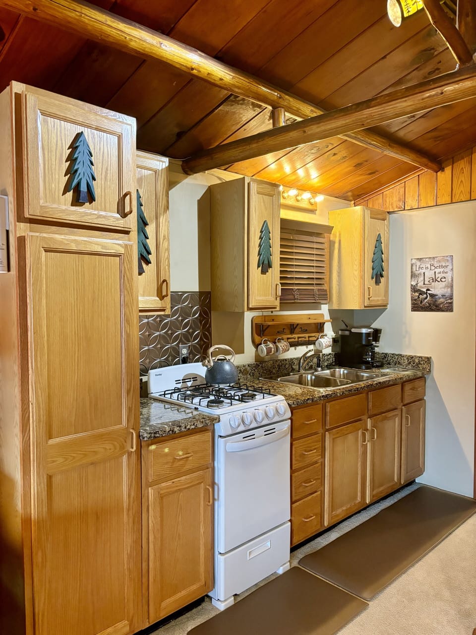 Loon Kitchen includes fridge, stove, microwave, Keurig, cooking and dishware.