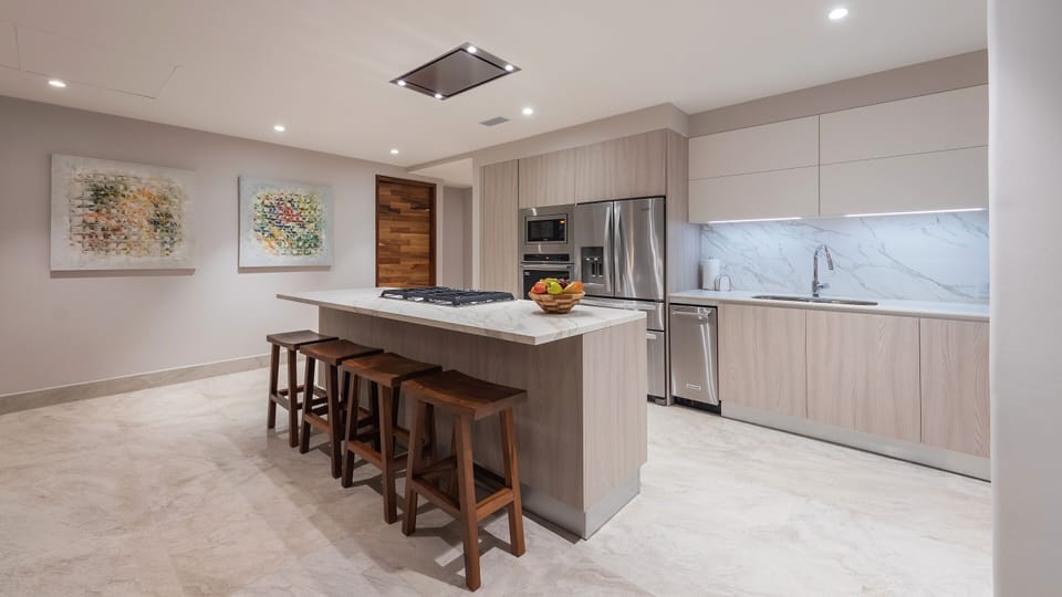 Kitchen area with separate ice maker and water filtration system