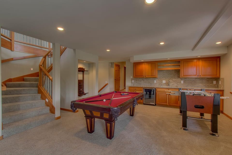 - Game room with pool table and foosball fun  
- Wet bar with fridge and spacious layout  
- Great spot for friendly competition indoors
