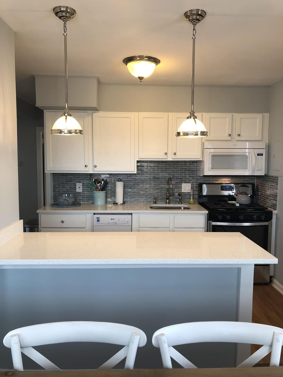 Quartz countertops and modern appliances.