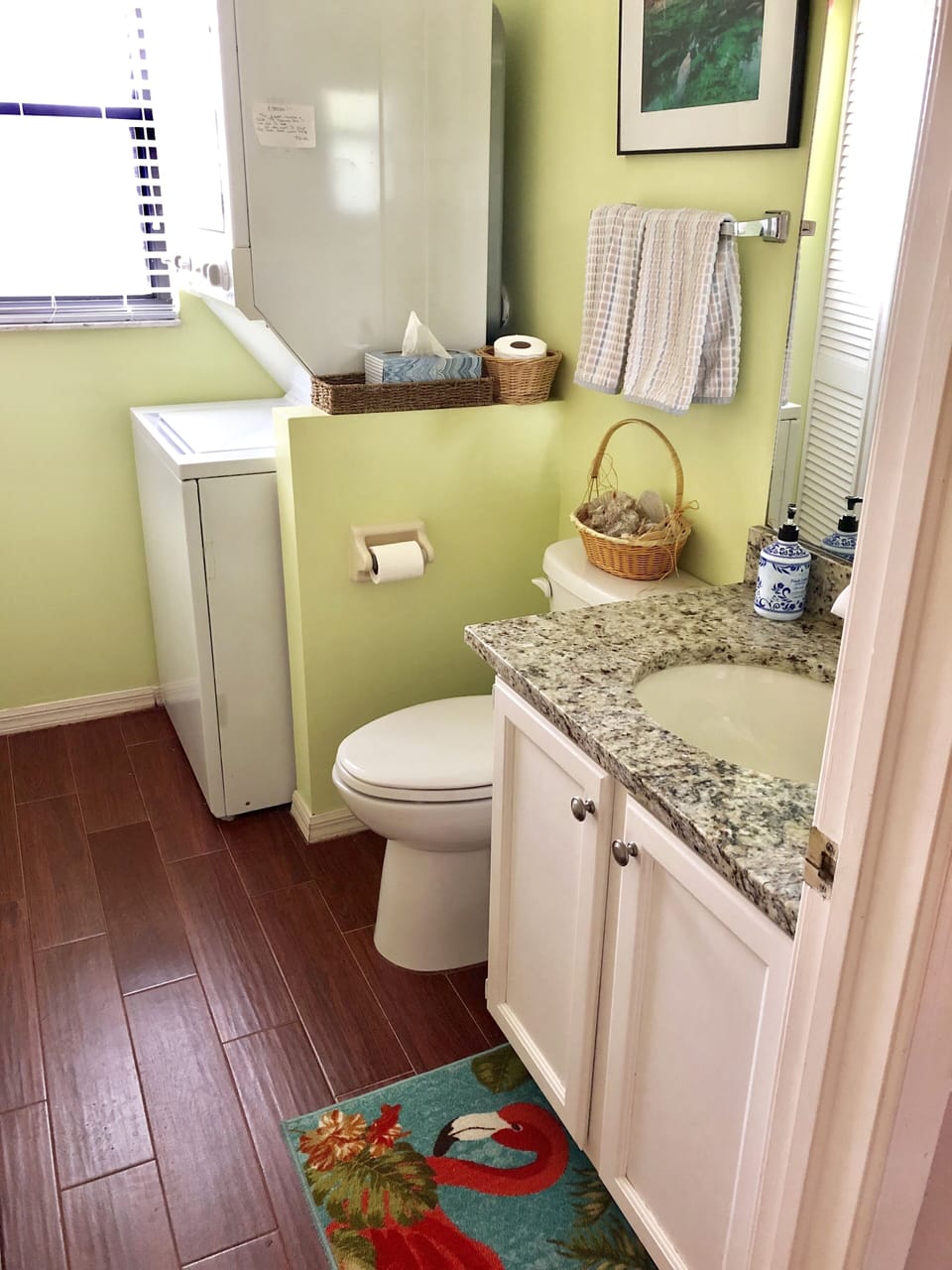 Downstairs half bath and laundry room (between kitchen and reading room).