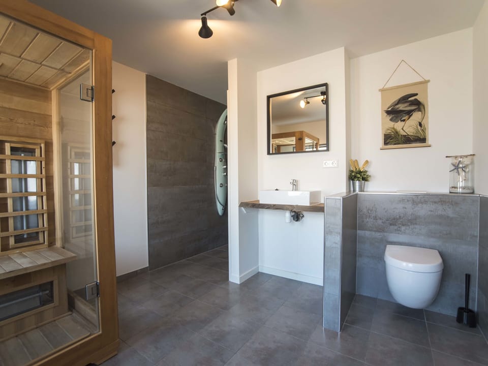 Our private luxurious bathroom with a power shower and sauna