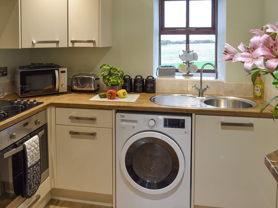 Well-equipped fitted kitchen | Dew Cottage, St Buryan, near Sennen