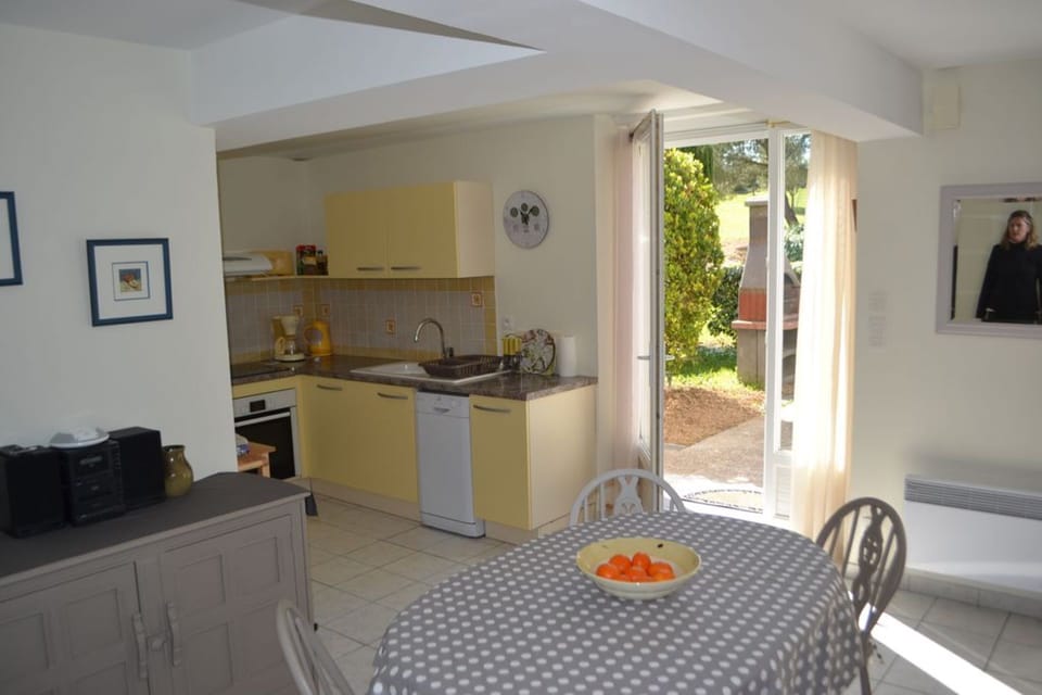 Open plan well equiped kitchen leading to the patio and BBQ