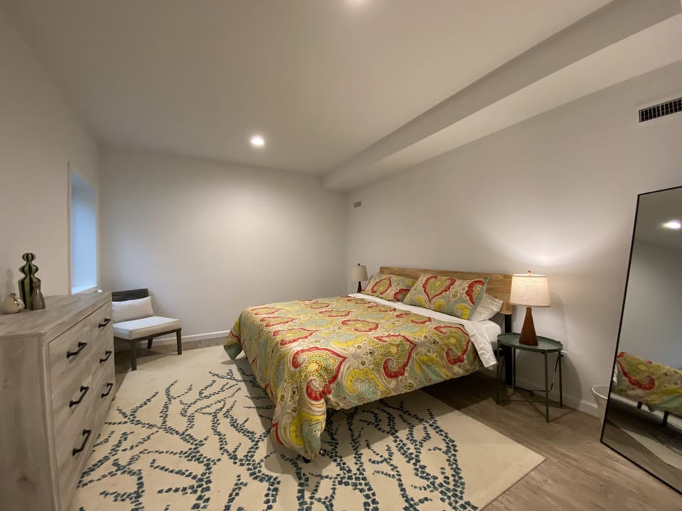 Basement king bedroom. Closets and bath in hallway. Very private 9 ft. ceilings