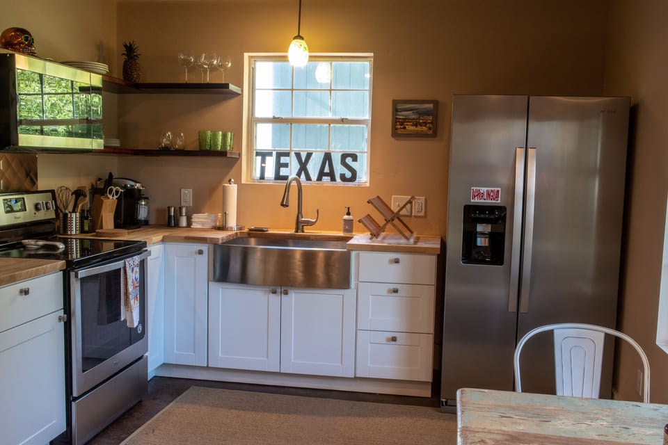 Open floorpan kitchen and dining area.  Coffee maker & electric hot water boiler