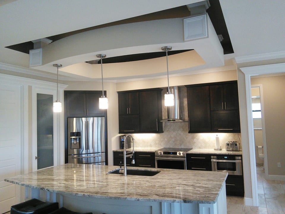 Beautiful, bright kitchen  granite, suspended floating ceil with back lighting.
