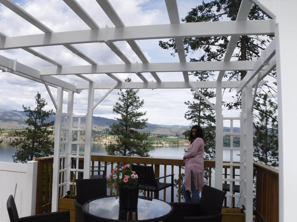 Sip morning coffee, or local wine while looking at Manson across the lake.