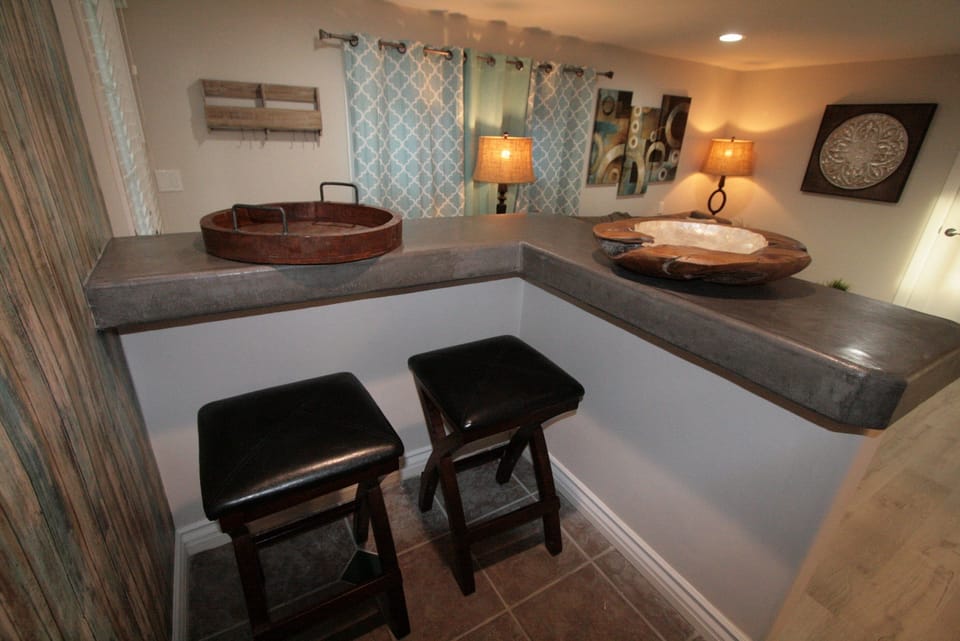 Bar and dining area is a great place to sit for meals, stools are inside the counter area.