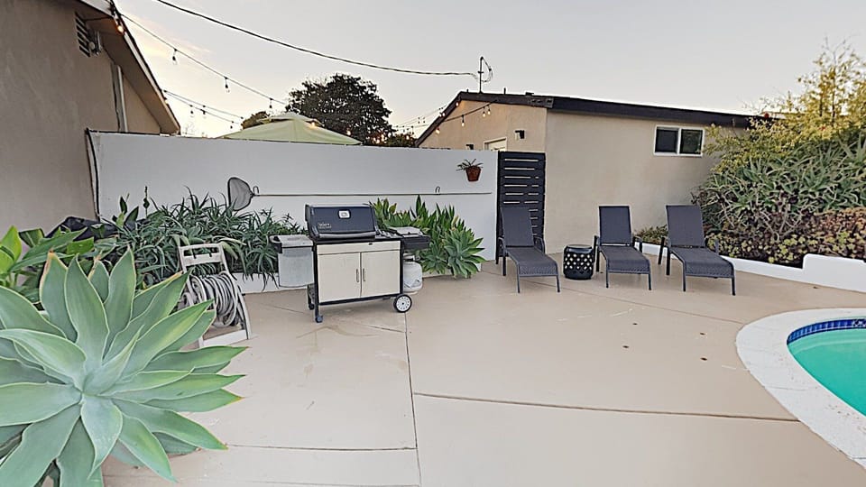 Private Heated (heating optional) Pool, with child Safety fence, Hot Tub, Weber BBQ, lounge chairs and Covered Patio area with fire pit and furniture to sit & relax!