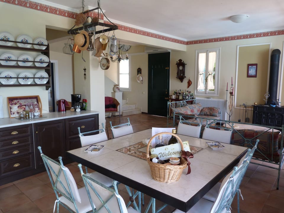 The kitchen and part of the living room in ground floor