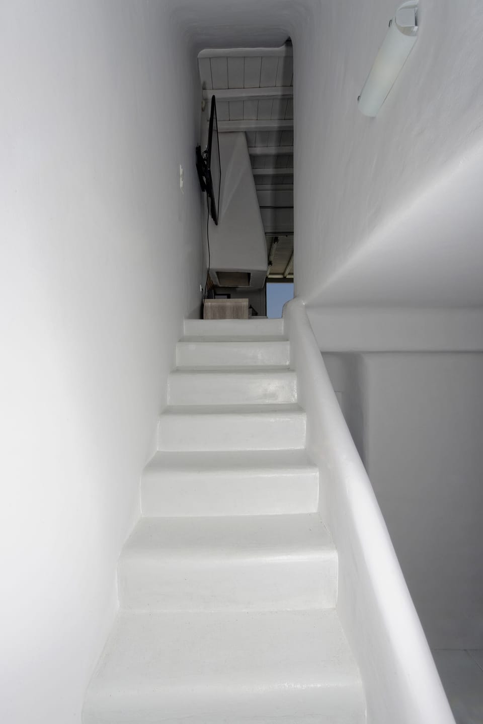 Stairs connecting the three levels of the villa