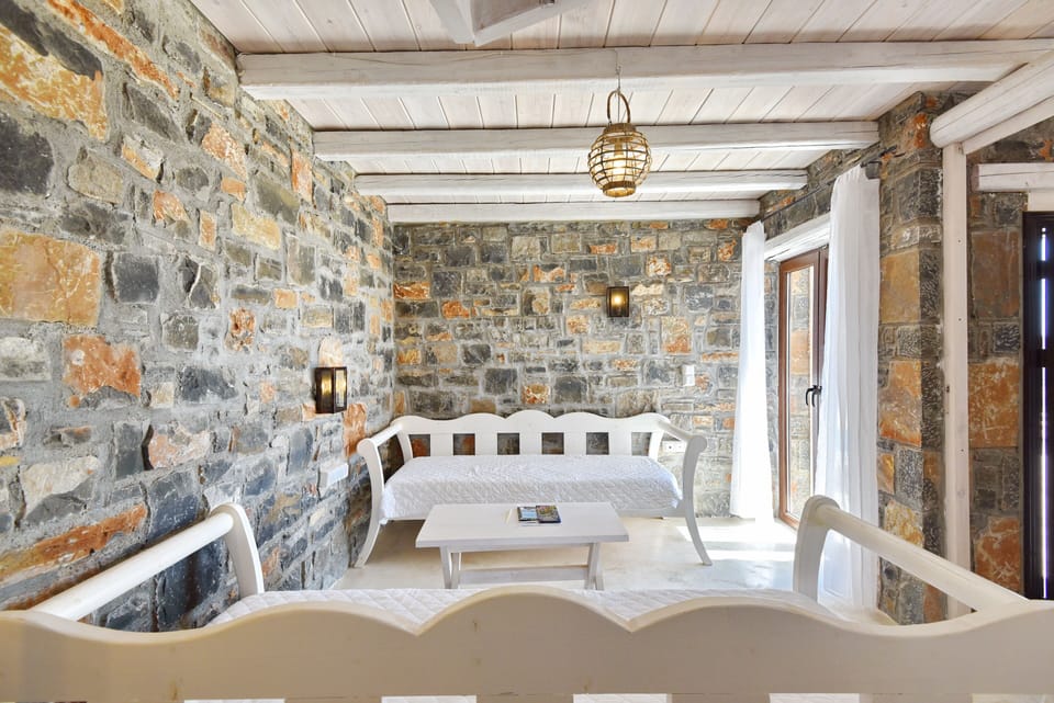 Living room with two sofa beds and door to the patio