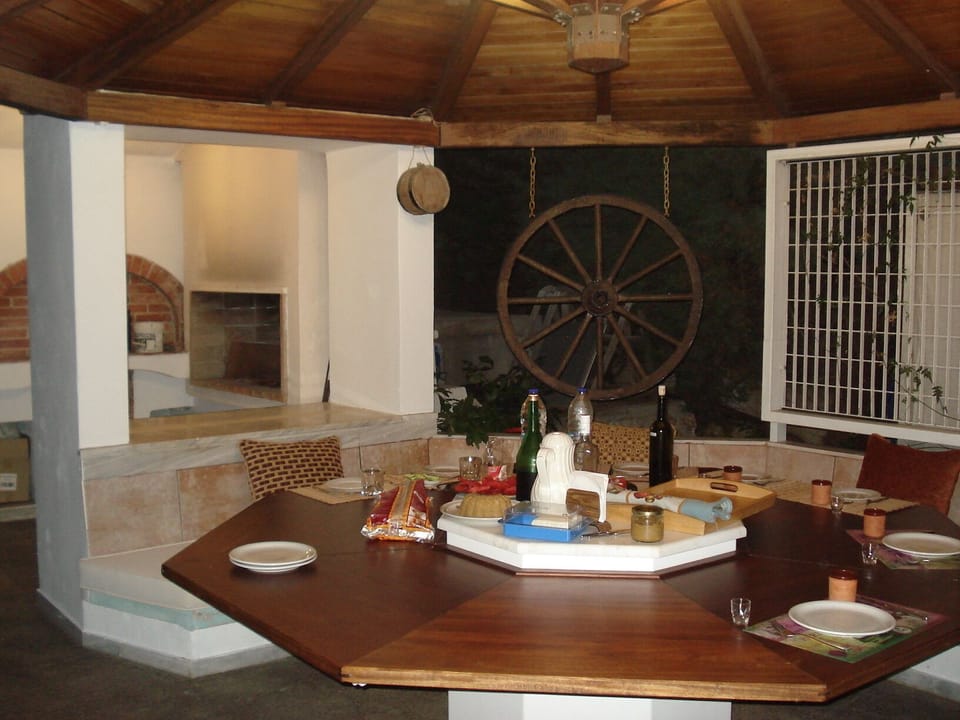 Octagon wooden table under the kiosk