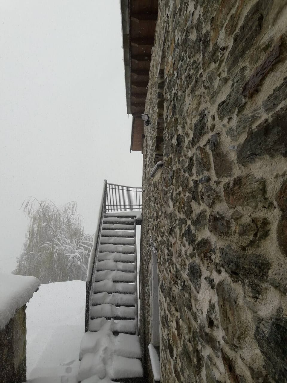 House in winter with snow stairs 
