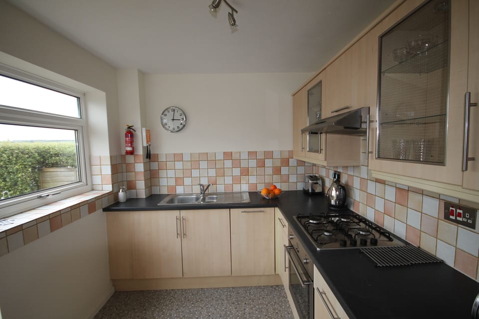 Kitchen leading on to decked area
dishwasher and WM