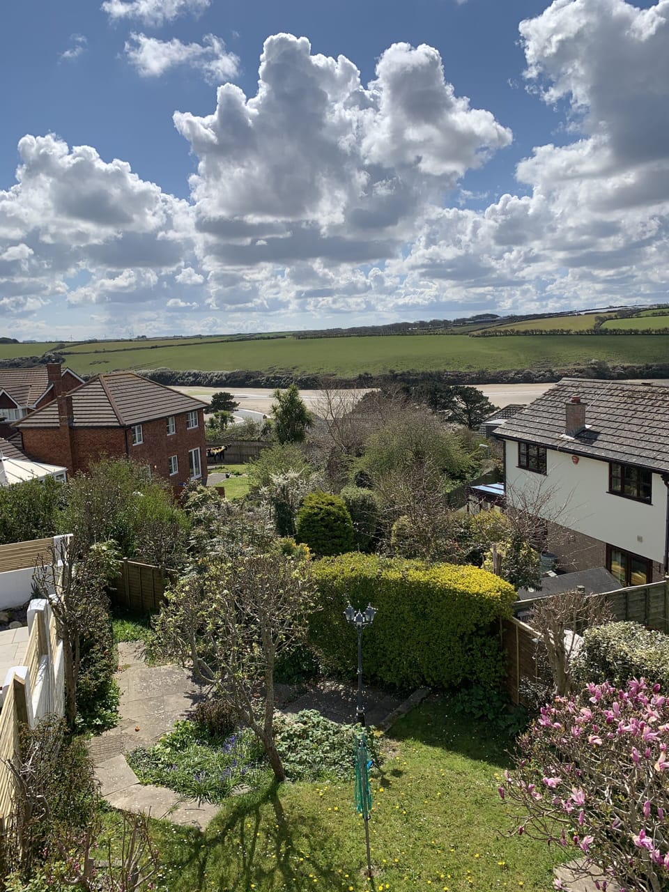 Private rear garden with decked area and glimpses of the River gannel