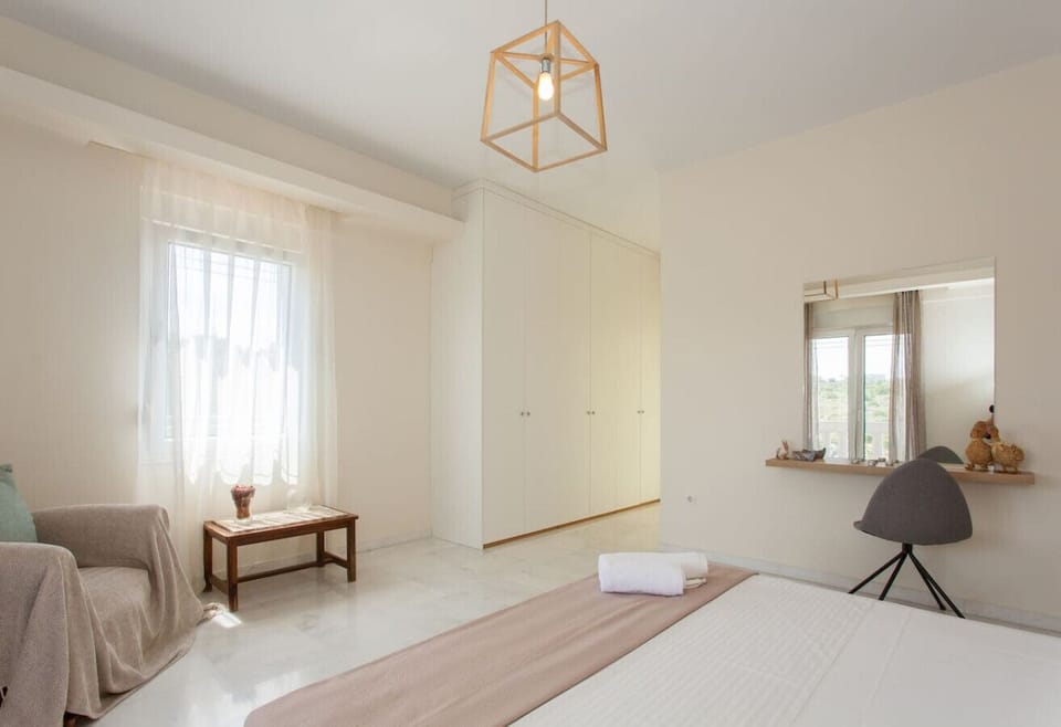 This bedroom features soft lighting and ample storage.