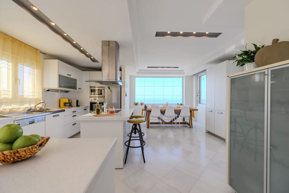 Open-concept kitchen with adjacent dining area, perfect for shared meals and conversation.
