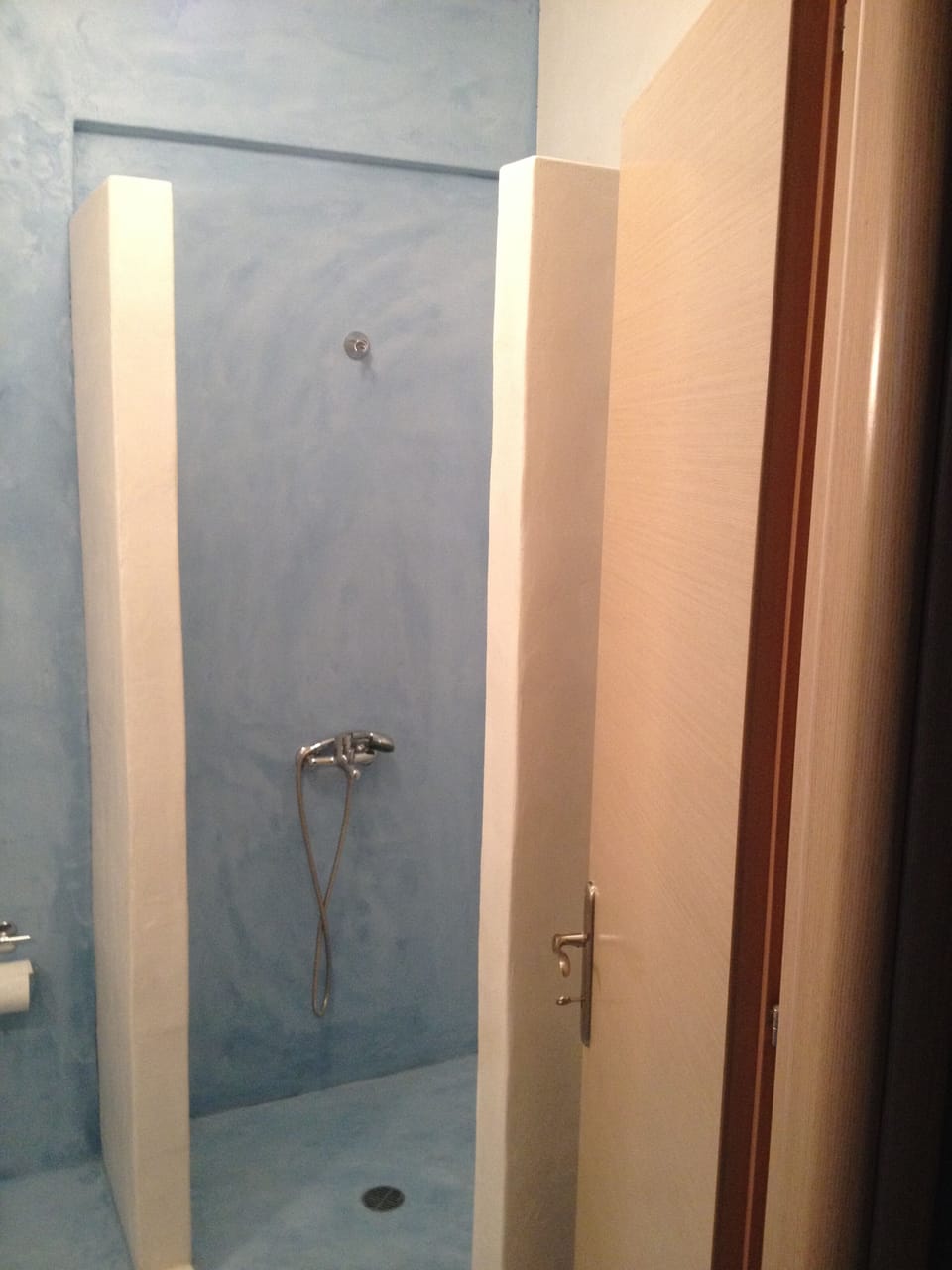 Bathroom with shower and washing machine