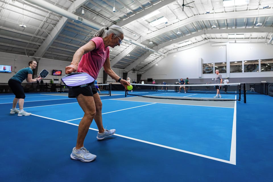 Engage in friendly games on bright indoor pickleball courts, perfect for active mornings or friendly competition with your travel companions.