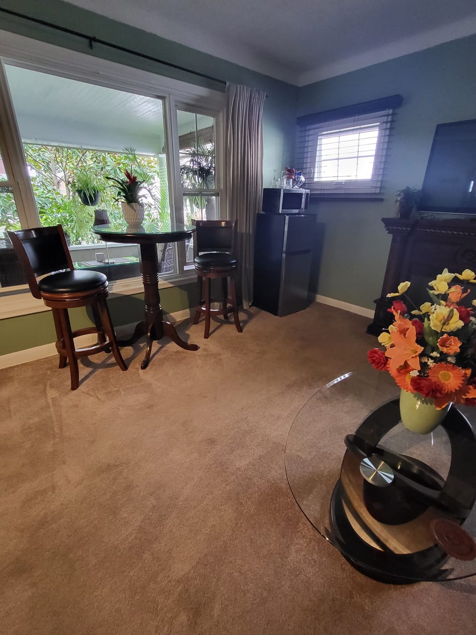 Looking into main suite room facing eating area.