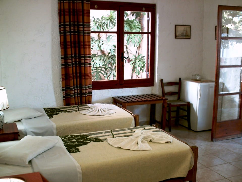 Twin bedded room with private facilities