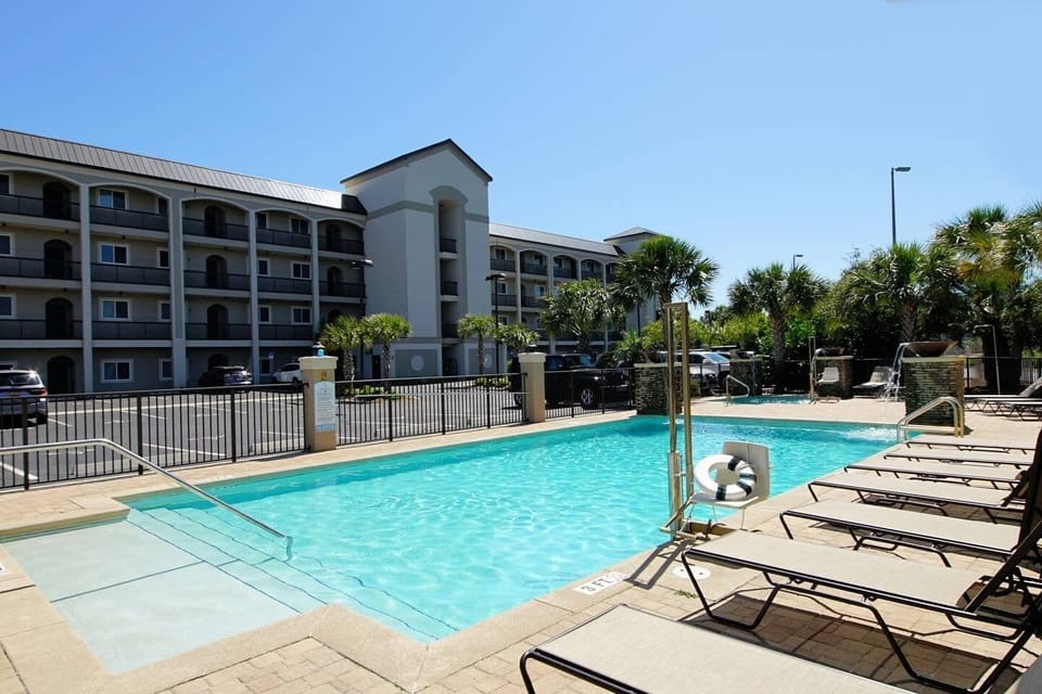 The beautiful hot tub with water features and large heated swimming pool is available to all guests. 