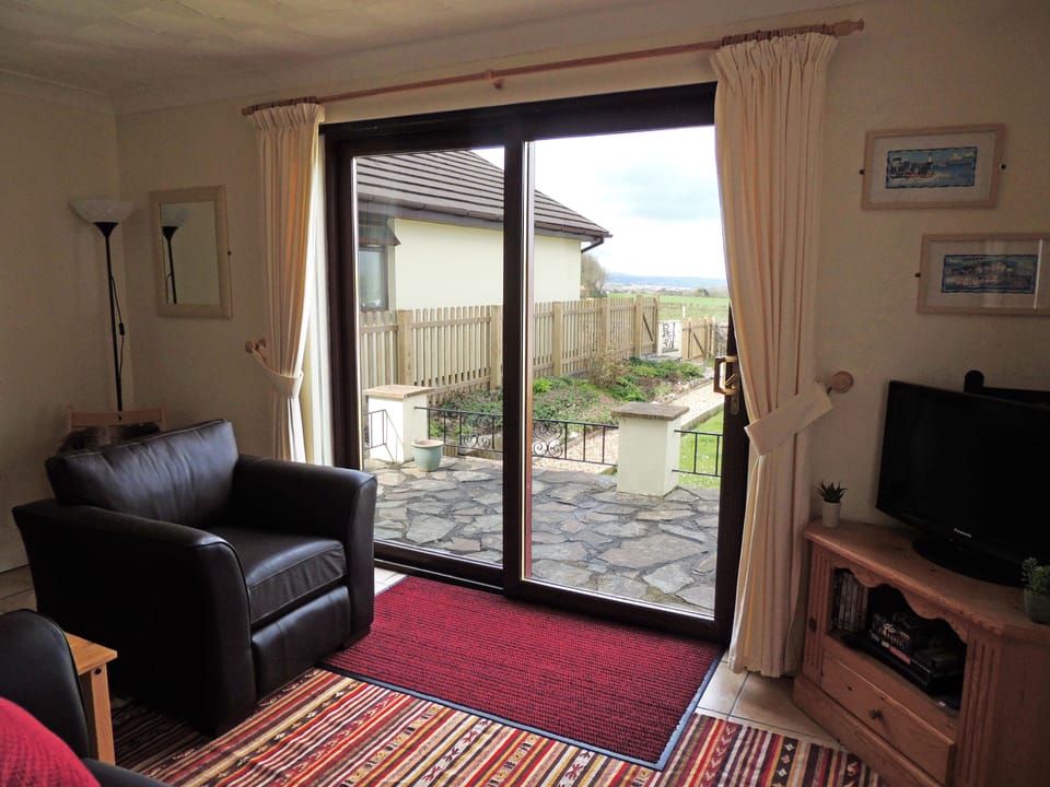 Living area with patio doors to terrace and own enclosed garden