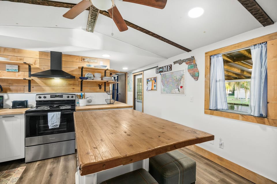 Kitchen has water views, and great window for passing food to the deck. 