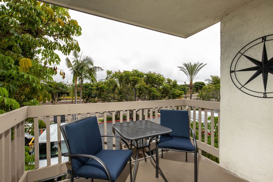 The balcony is off the living room.