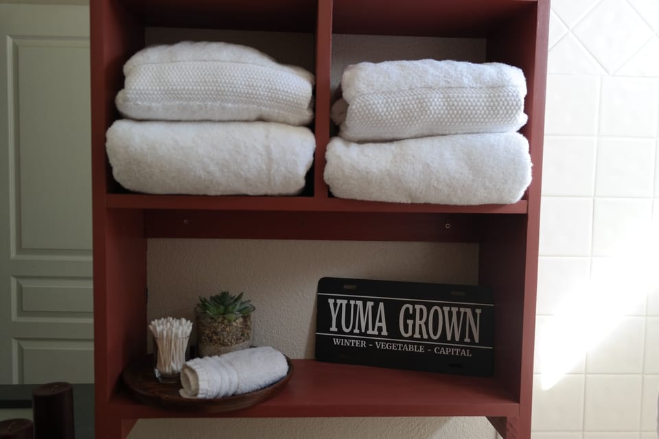 Guest bathroom includes bath tub/ shower combo, one sink and toilet. 