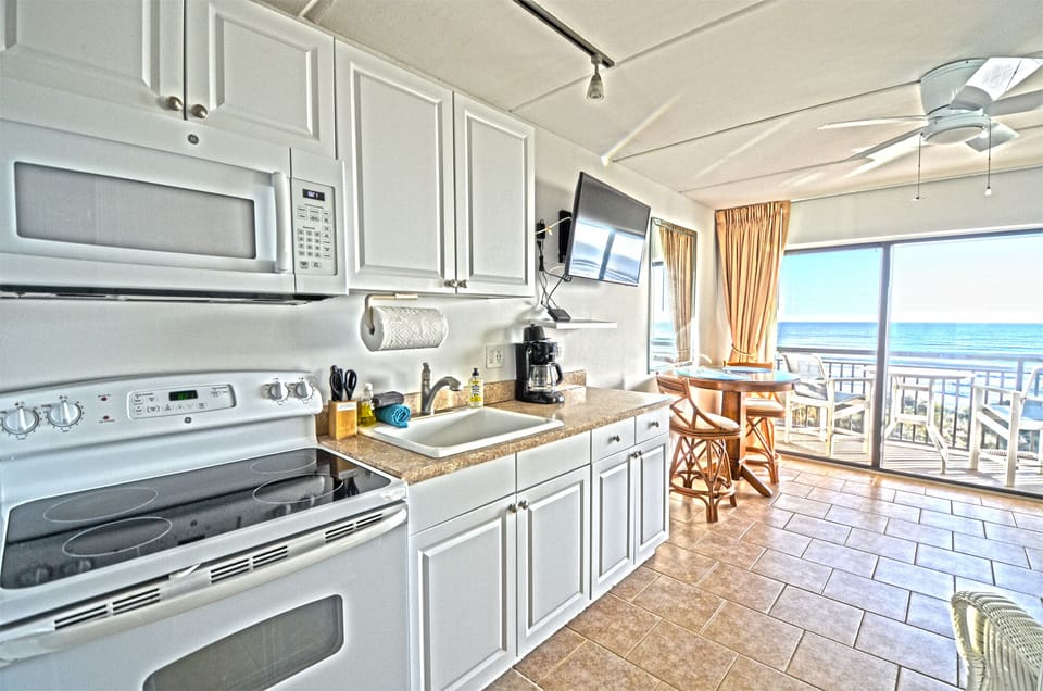 Fully stocked kitchen with oven/range, full size refrigerator, microwave & more.