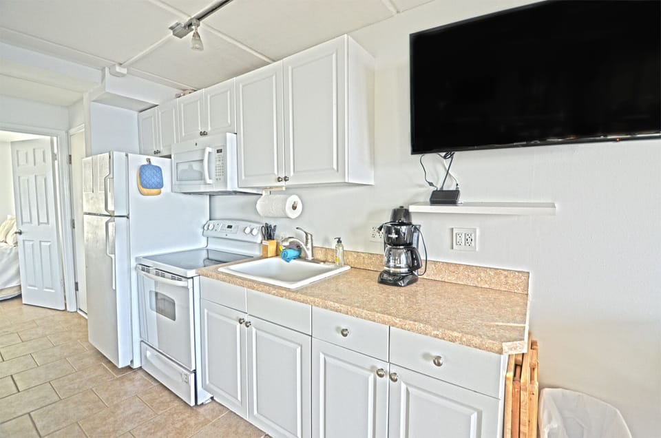 Fully stocked kitchen with oven/range, full size refrigerator, microwave & more.