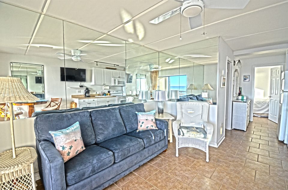 Sunny living area with pull out queen sofa bed for 1-2 kids and HD cable TV.