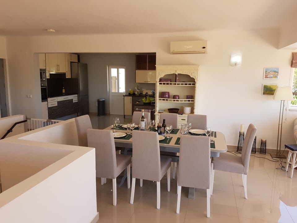 Inside dining and kitchen beyond