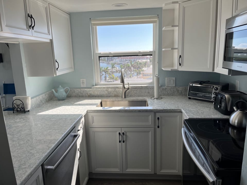 New kitchen with coastal colors has water views of the Intracoastal and Gulf!