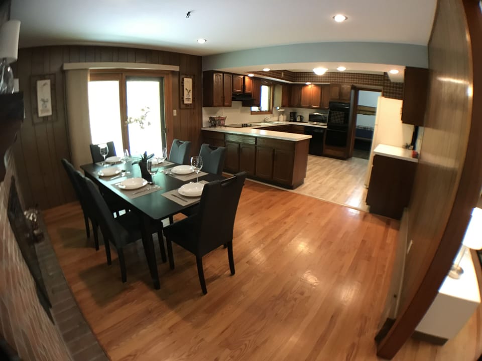 Living room on the right, patio is to the left, mudroom in the far then sunroom