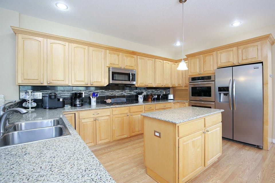 The double ovens, gas range and built in dishwasher will make cooking for a crowd a sure breeze!