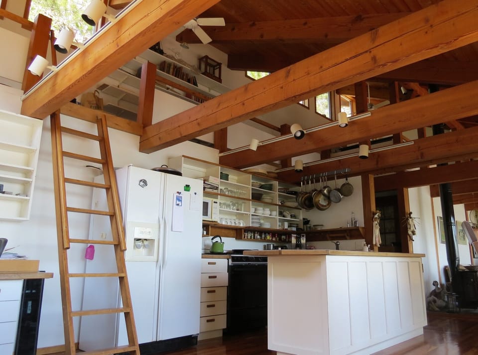 Ladder up to loft. Loft runs the length of the house.
