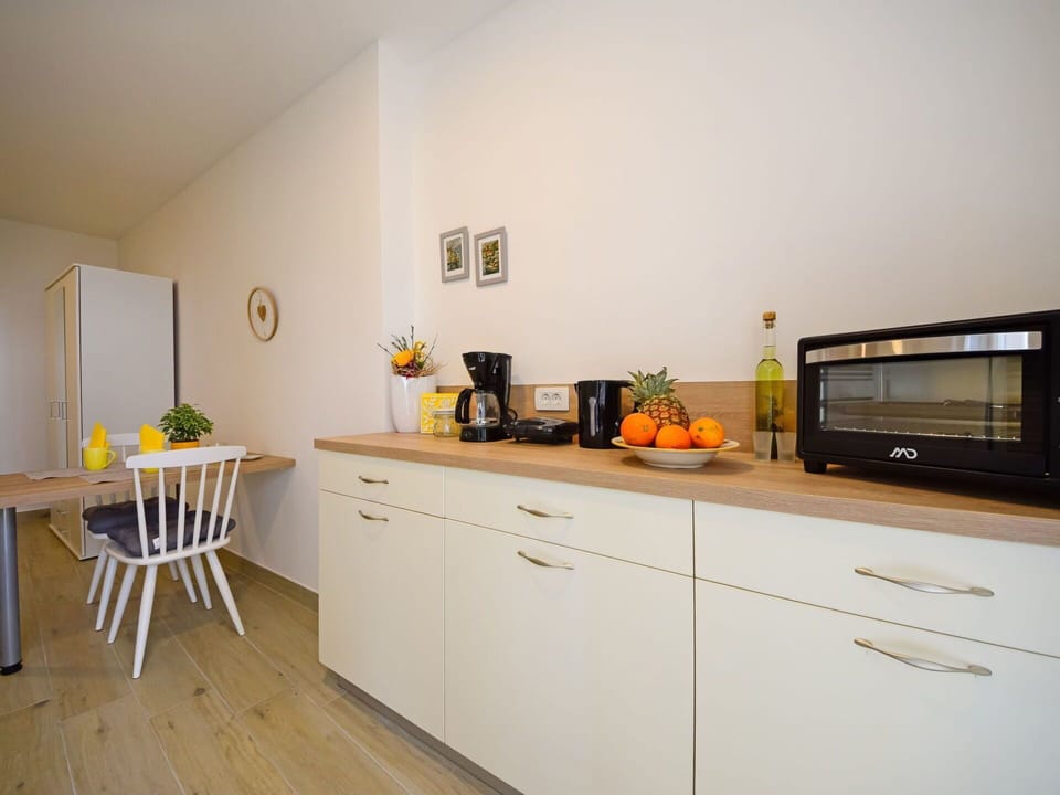 Room, Kitchen, Property, Countertop, Yellow, Furniture, Cabinetry, Interior Design, House, Floor
