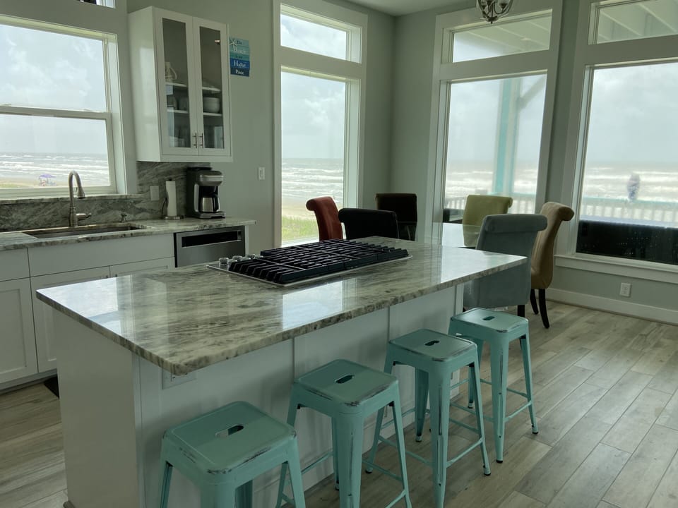 Kitchen and breakfast have breathtaking views of the beach!