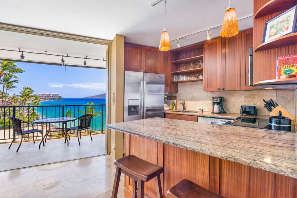 Open concept kitchen.  View towards your 18' lanai, the ocean and the coast.