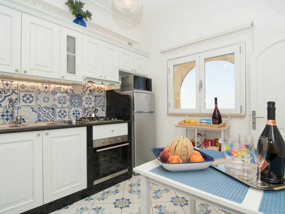 Countertop, Room, Property, Kitchen, Furniture, Tile, Interior Design, Blue, Floor, Cabinetry